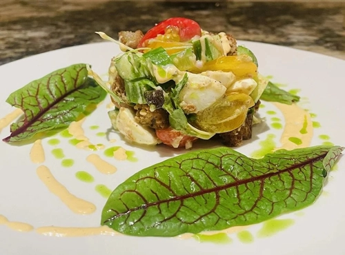 Hawaiian panzanella salad with Maui cherry tomatoes and Molokai sweet potato bread.