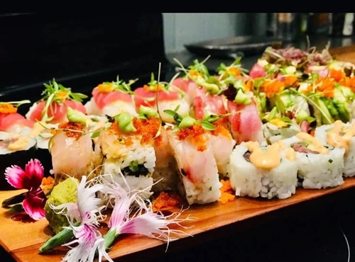 Assorted sushi platter with fresh fish and artful presentation.